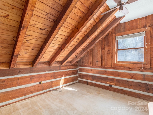 bonus room featuring vaulted ceiling with beams, wood walls, carpet floors, and wooden ceiling