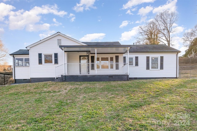 view of front of home with a porch and a front lawn