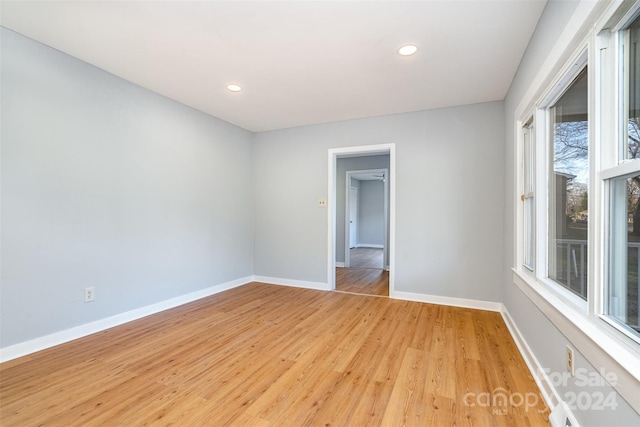 spare room featuring light hardwood / wood-style flooring