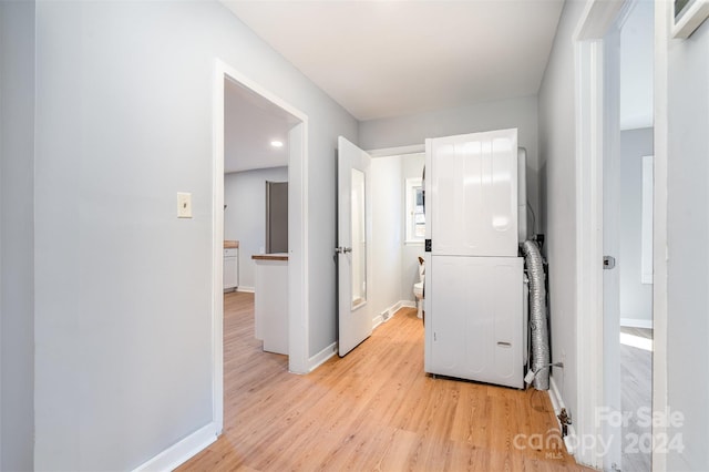 hallway with light hardwood / wood-style flooring