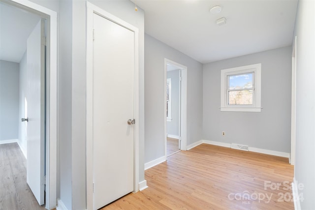 hallway featuring light wood-type flooring