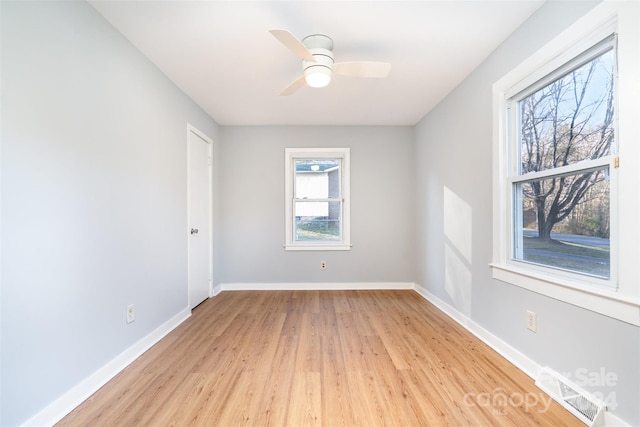 spare room featuring ceiling fan and light hardwood / wood-style flooring