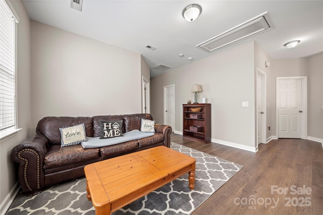 living room with dark hardwood / wood-style flooring