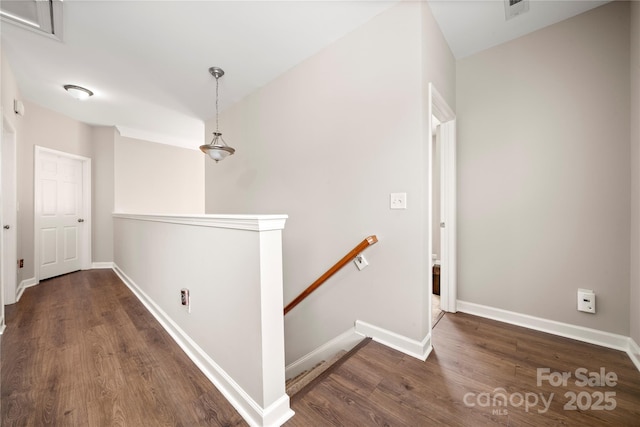 corridor featuring dark hardwood / wood-style flooring