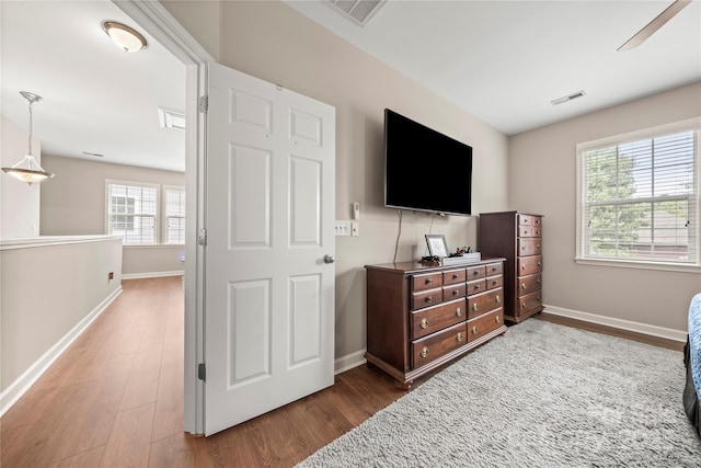 bedroom with ceiling fan and wood-type flooring