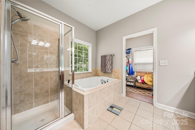 bathroom with tile patterned flooring and plus walk in shower