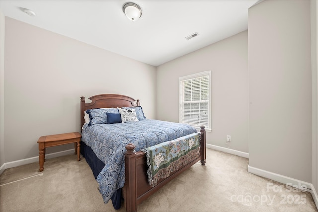 bedroom featuring light colored carpet