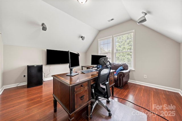 office featuring dark hardwood / wood-style floors and vaulted ceiling