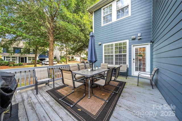 wooden terrace featuring grilling area