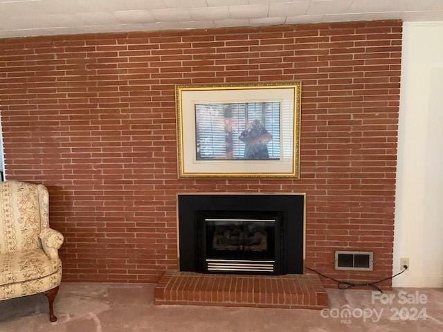 details with carpet floors and a brick fireplace