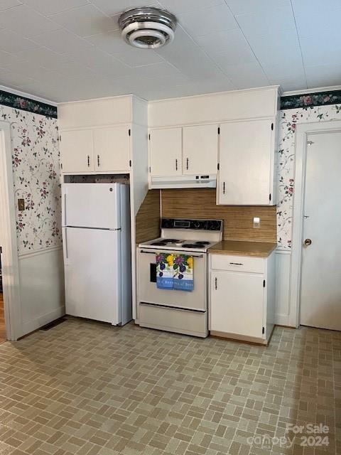 kitchen with white cabinets and white appliances