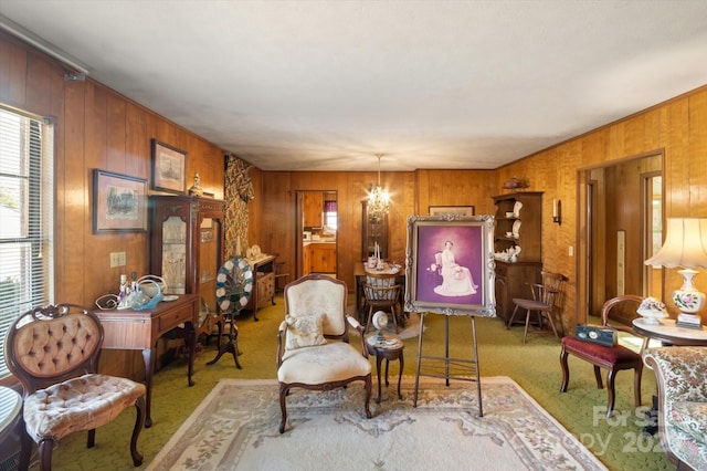 living area with carpet flooring, an inviting chandelier, and plenty of natural light