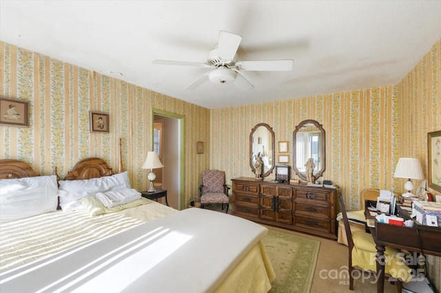 bedroom with ceiling fan and light colored carpet