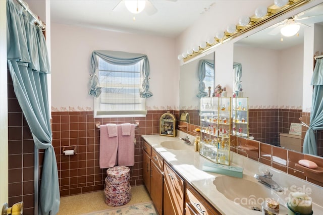 bathroom featuring tile patterned floors, vanity, and tile walls