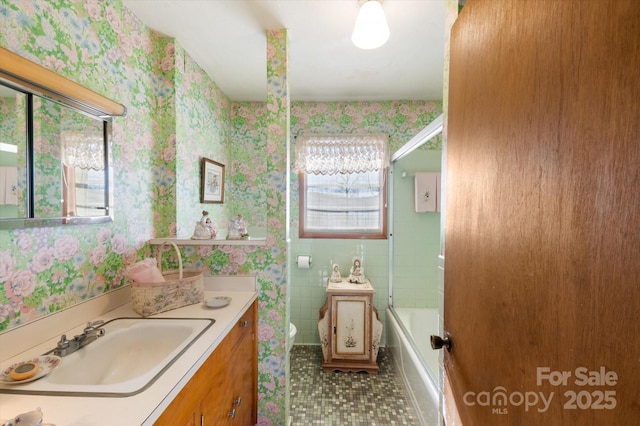 full bathroom with bathing tub / shower combination, tile patterned floors, vanity, and toilet