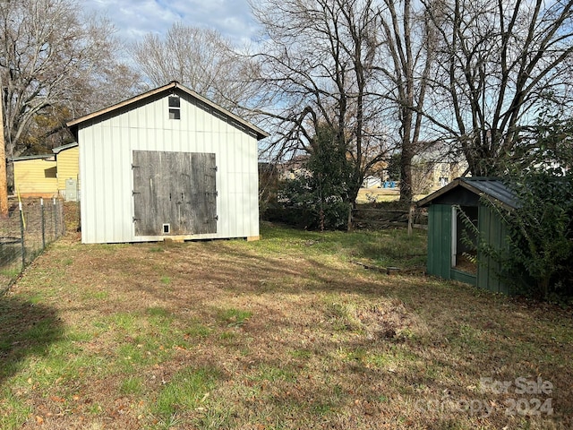 view of outbuilding with a lawn