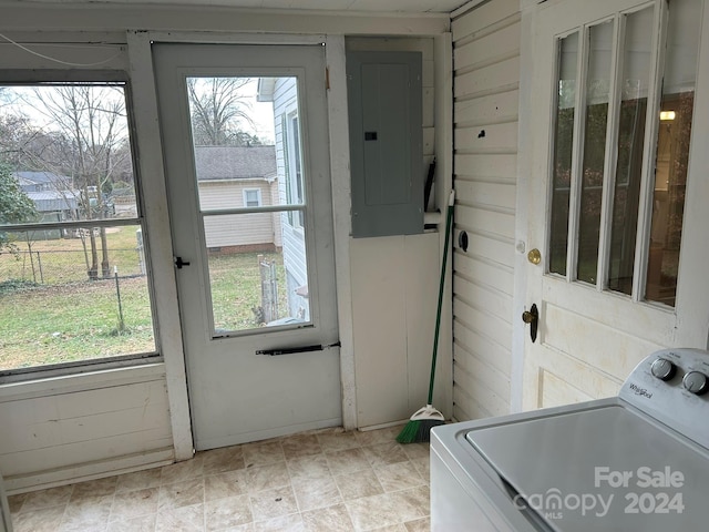 entryway featuring washer / clothes dryer, electric panel, and a healthy amount of sunlight