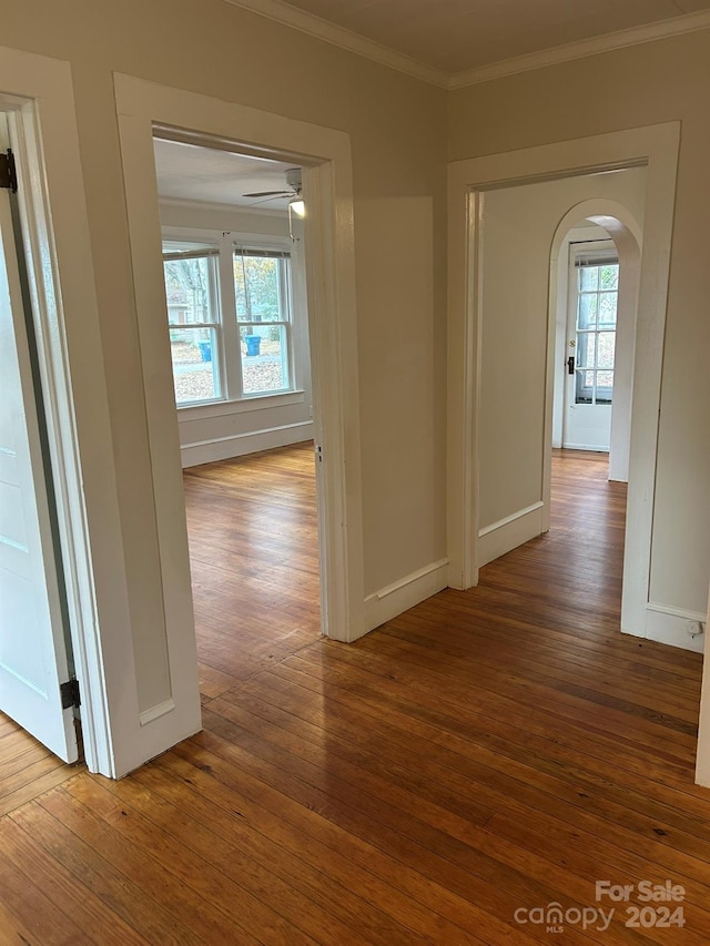 hall featuring hardwood / wood-style flooring and ornamental molding