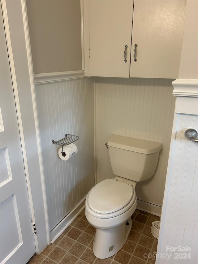 bathroom with tile patterned flooring and toilet