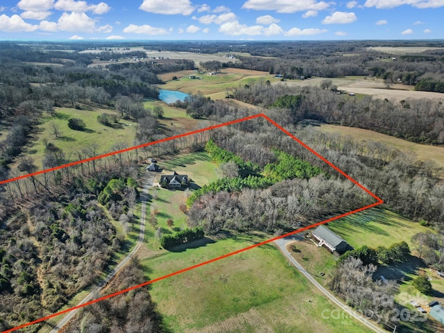 aerial view featuring a rural view and a water view