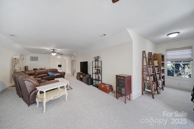 carpeted living room featuring ceiling fan