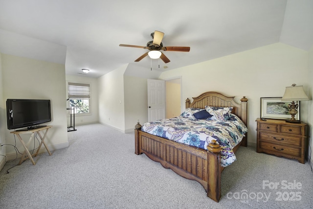 carpeted bedroom with ceiling fan and lofted ceiling