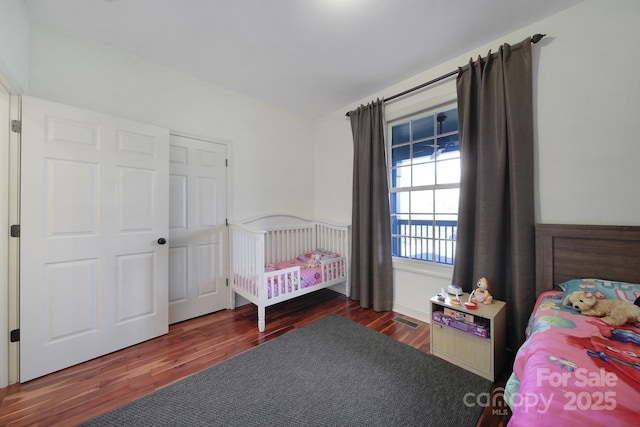 bedroom featuring dark hardwood / wood-style flooring