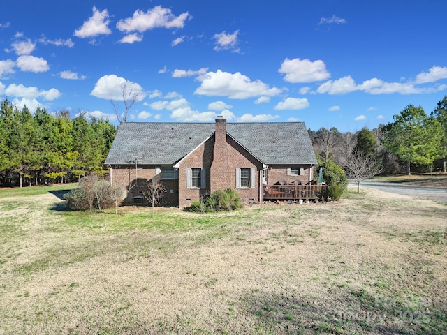 exterior space with a yard and a deck