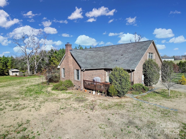 view of side of property with a deck