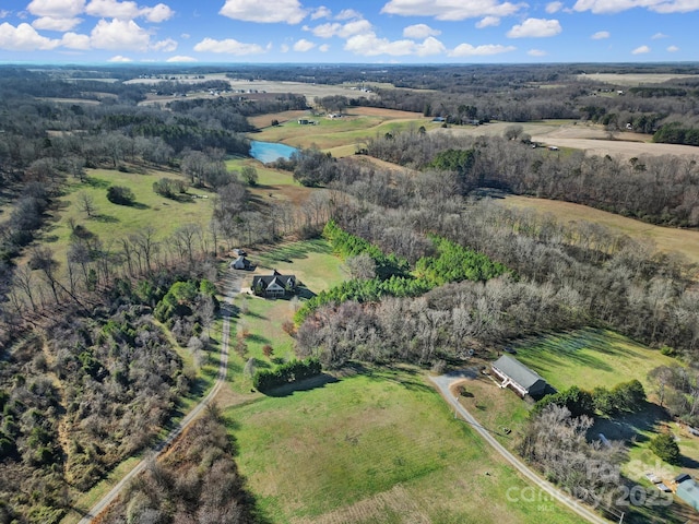 bird's eye view with a rural view and a water view