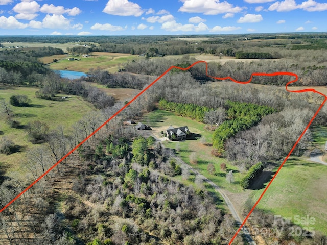 birds eye view of property featuring a rural view and a water view