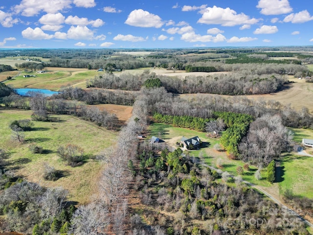 aerial view with a rural view and a water view