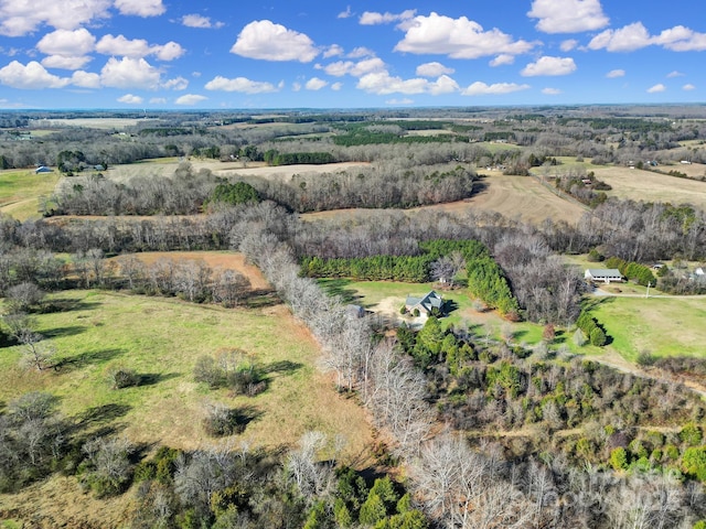 birds eye view of property with a rural view