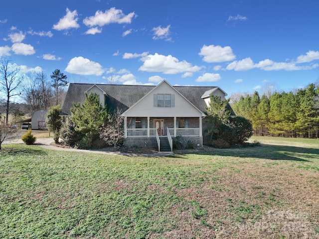 view of front of home featuring covered porch and a front yard