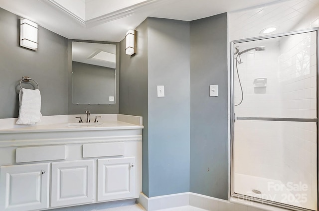 bathroom featuring walk in shower and vanity