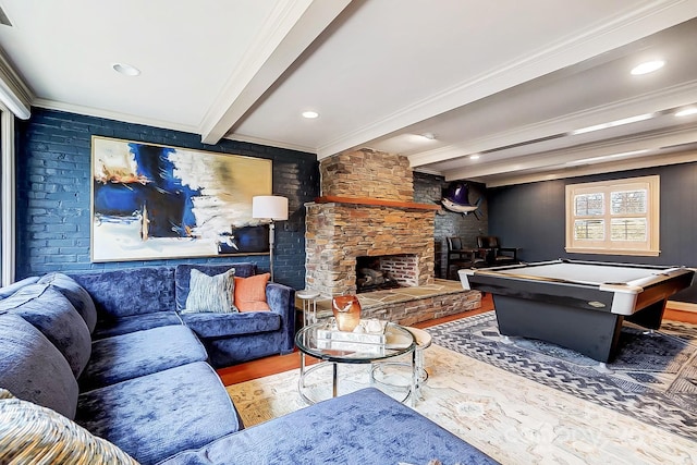 interior space with pool table, beam ceiling, a fireplace, ornamental molding, and wood-type flooring