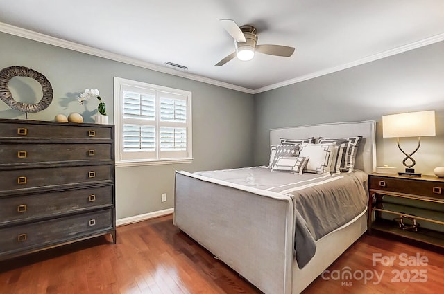 bedroom with ceiling fan, crown molding, and dark hardwood / wood-style floors