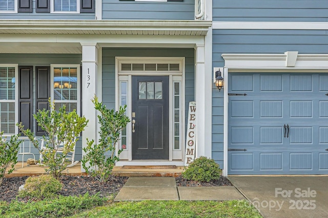 property entrance with a garage