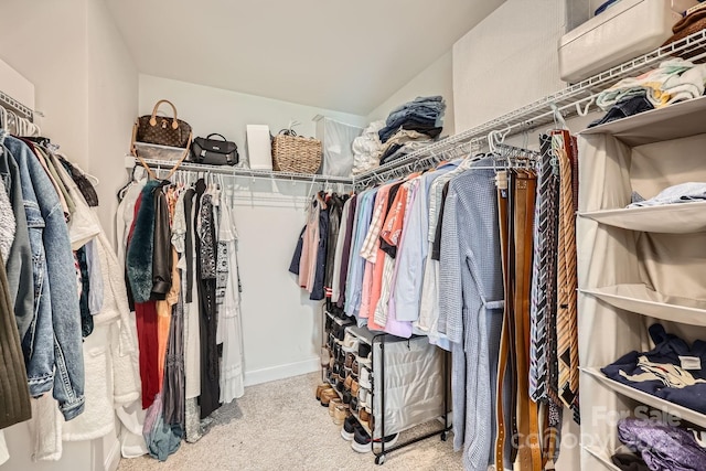 spacious closet with carpet floors