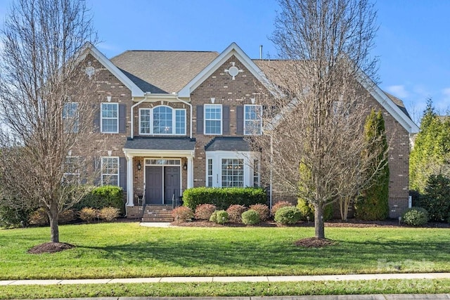 view of front of property with a front lawn