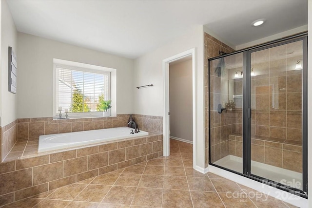 bathroom with tile patterned floors and plus walk in shower