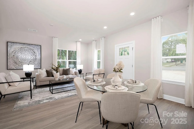 dining area with light hardwood / wood-style floors