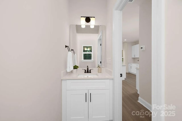 bathroom featuring vanity and hardwood / wood-style flooring