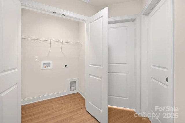 laundry area featuring hookup for a washing machine, hardwood / wood-style floors, and hookup for an electric dryer