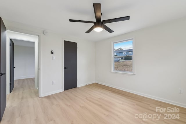 unfurnished bedroom with light wood-type flooring and ceiling fan