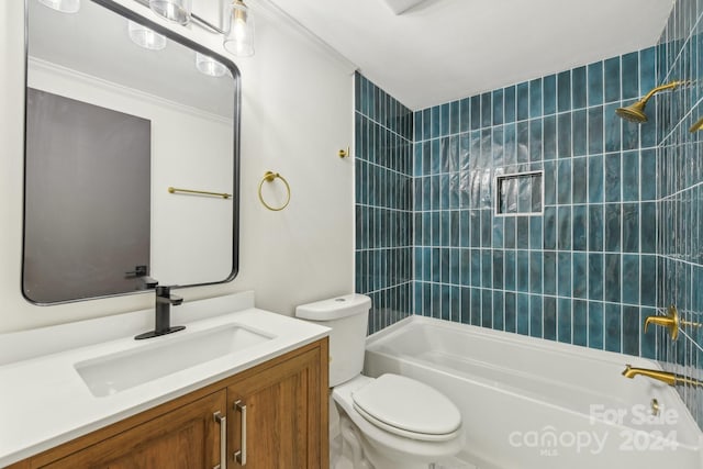 full bathroom with tiled shower / bath combo, toilet, crown molding, and vanity