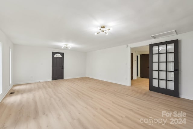 spare room featuring light hardwood / wood-style floors