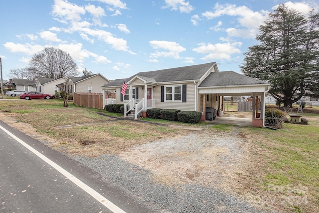 view of front of property featuring a carport