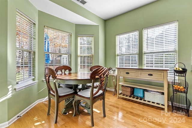 dining area with light hardwood / wood-style floors