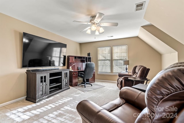 office space with ceiling fan, light colored carpet, and vaulted ceiling